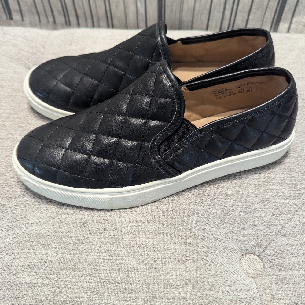 Black quilted slip ons
